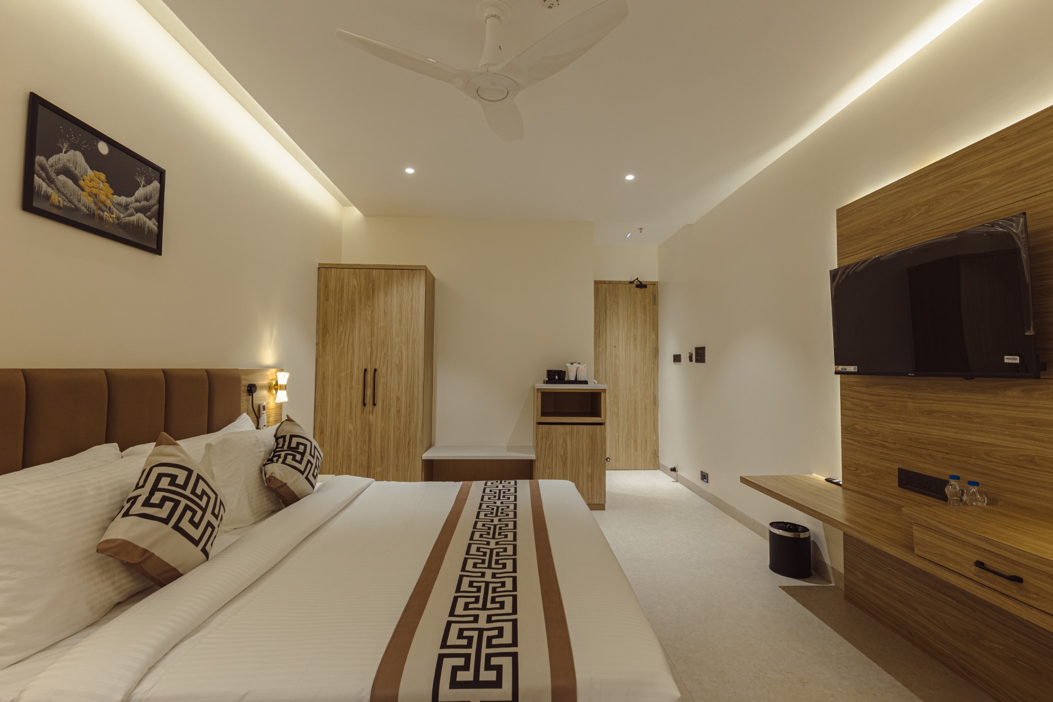 Warm, sunlit bedroom at Stay Orra